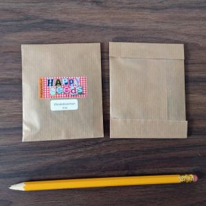 Kraft papieren zakje met weidebloemenzaden